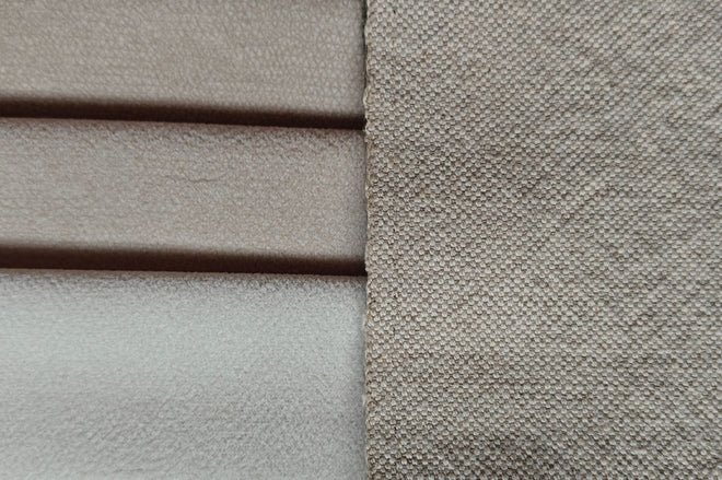 Side by side comparison of natural and pet friendly fabrics with pet friendly fabric showing a much tighter weave