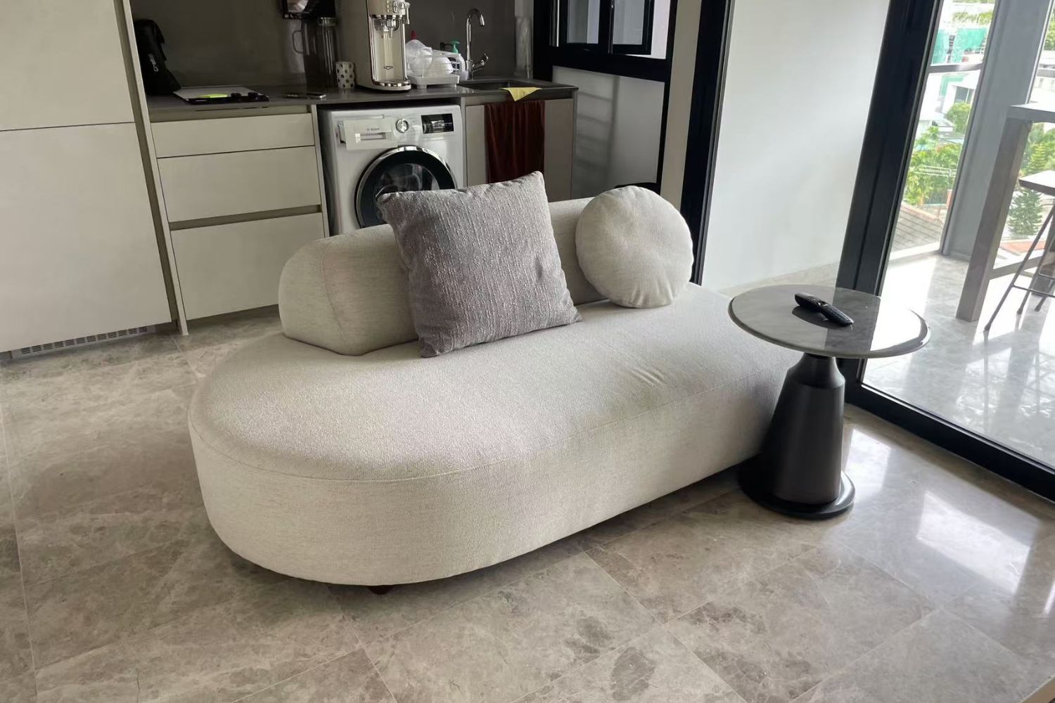 Curved white 2 seater fabric sofa