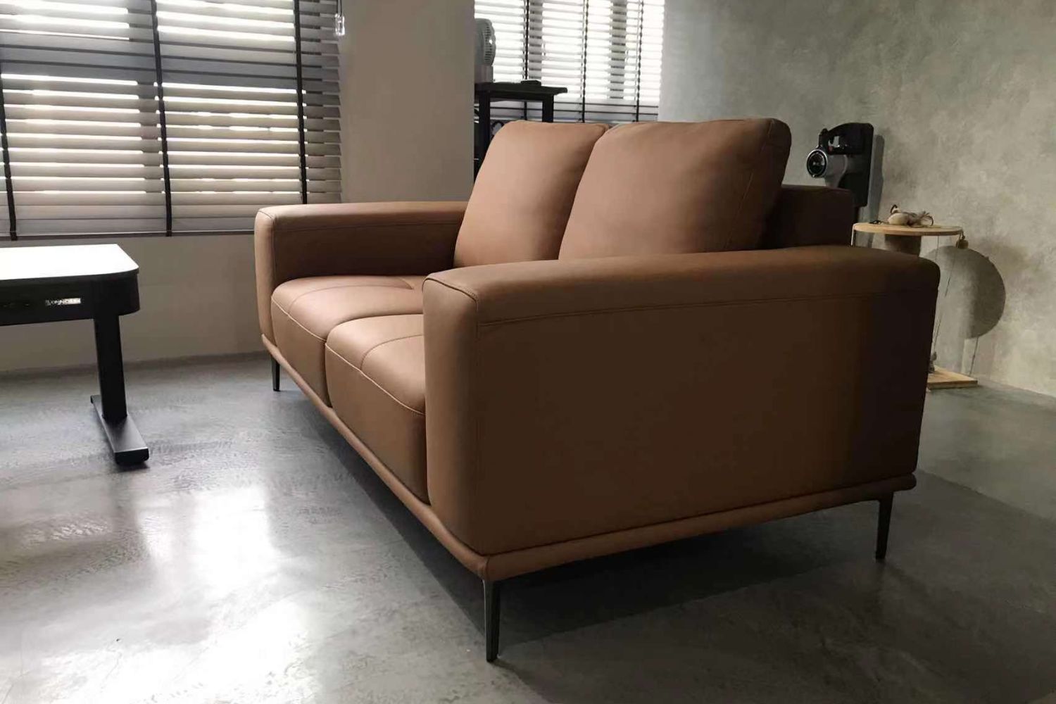 Calm 180cm brown full leather sofa in customer's industrialist themed home