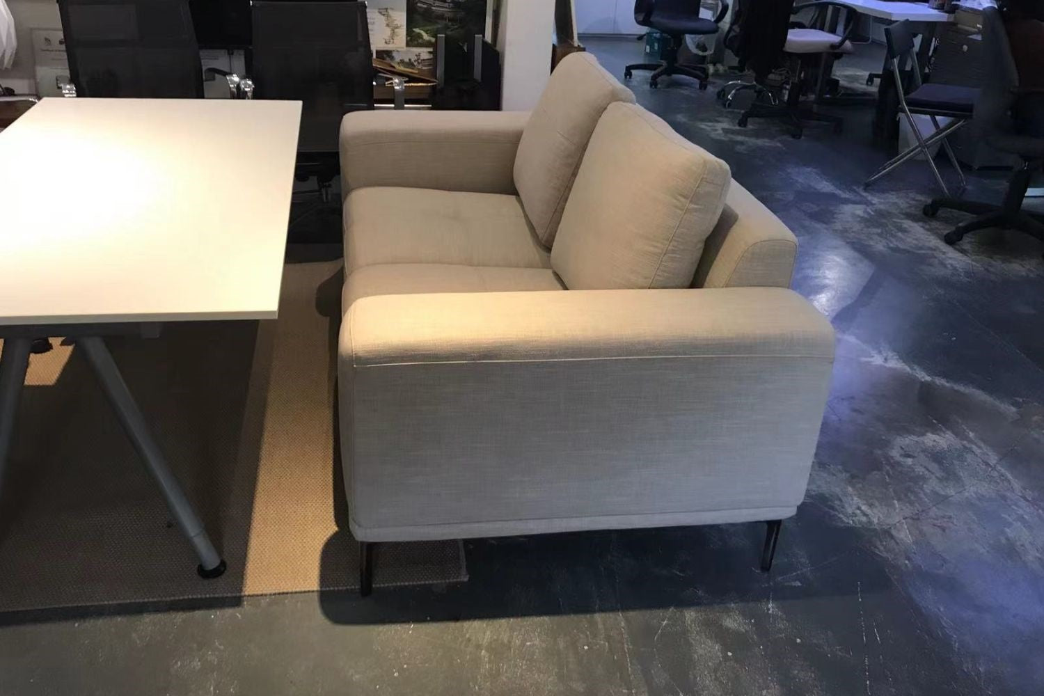 Calm 180cm grey fabric sofa in customer's office