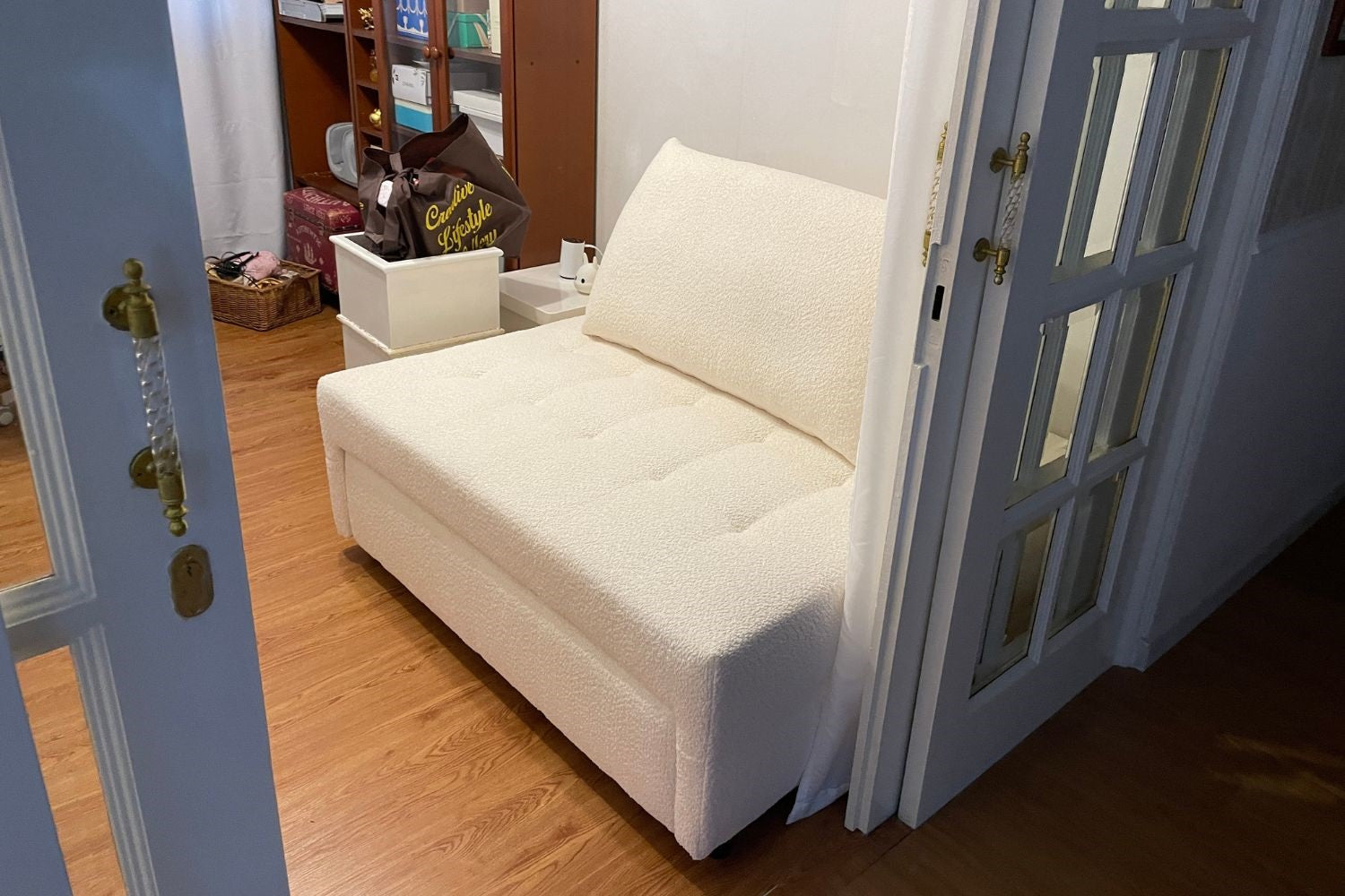 Candy 125cm white boucle fabric sofa bed in customer's home