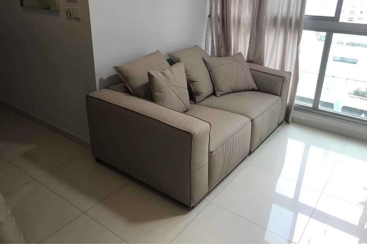 Carson 180cm half leather sofa with no side weavings in customer's home
