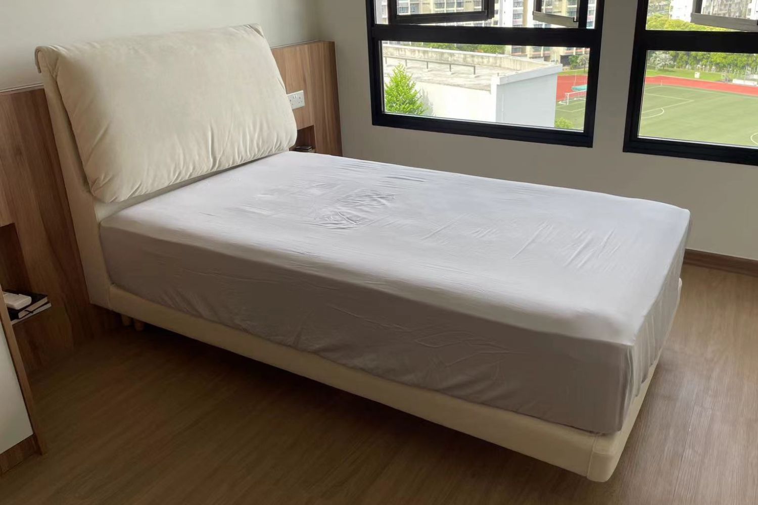 Comfy white fabric single size bed frame