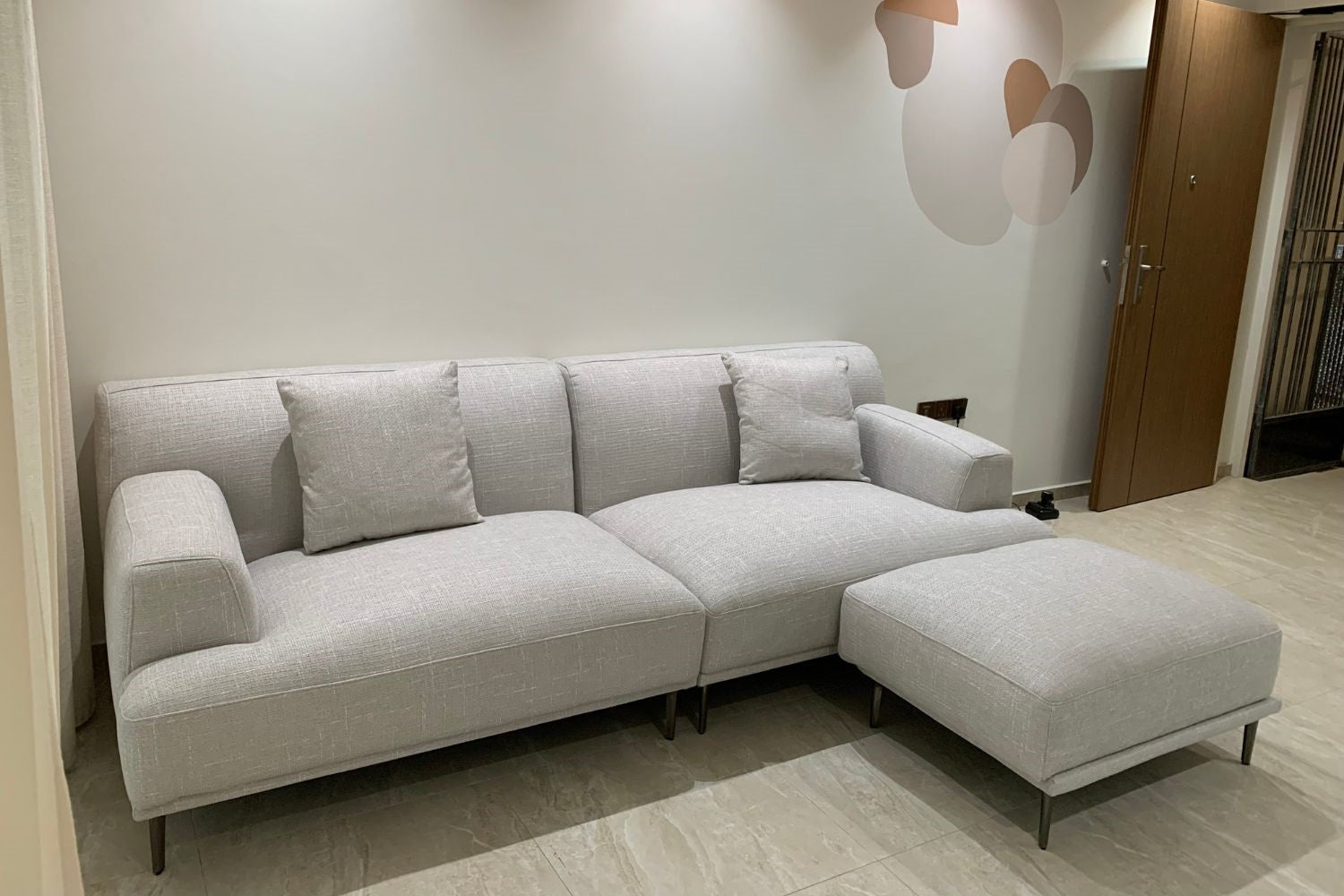 Crystal 240cm grey fabric sofa + ottoman in customer's home