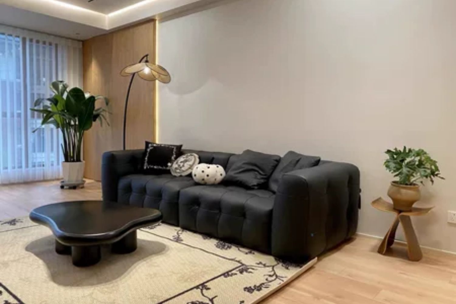 Cutey black leather sofa in customer's home