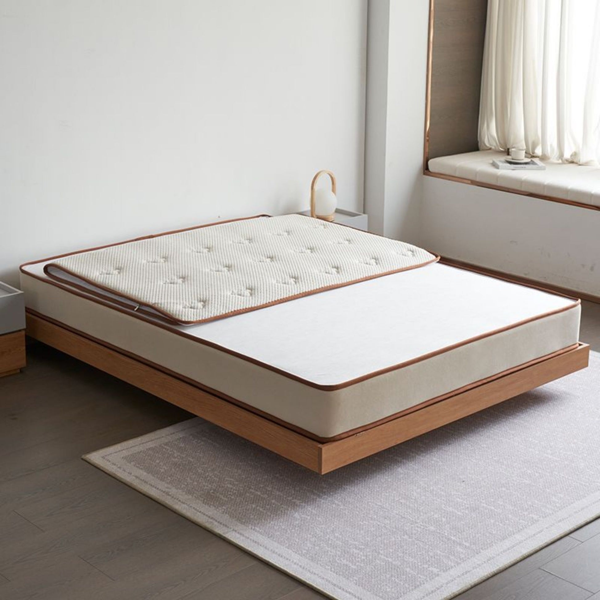 Smile mattress in bedroom with removable mattress cover partially unzipped
