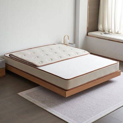 Smile mattress in bedroom with removable mattress cover partially unzipped
