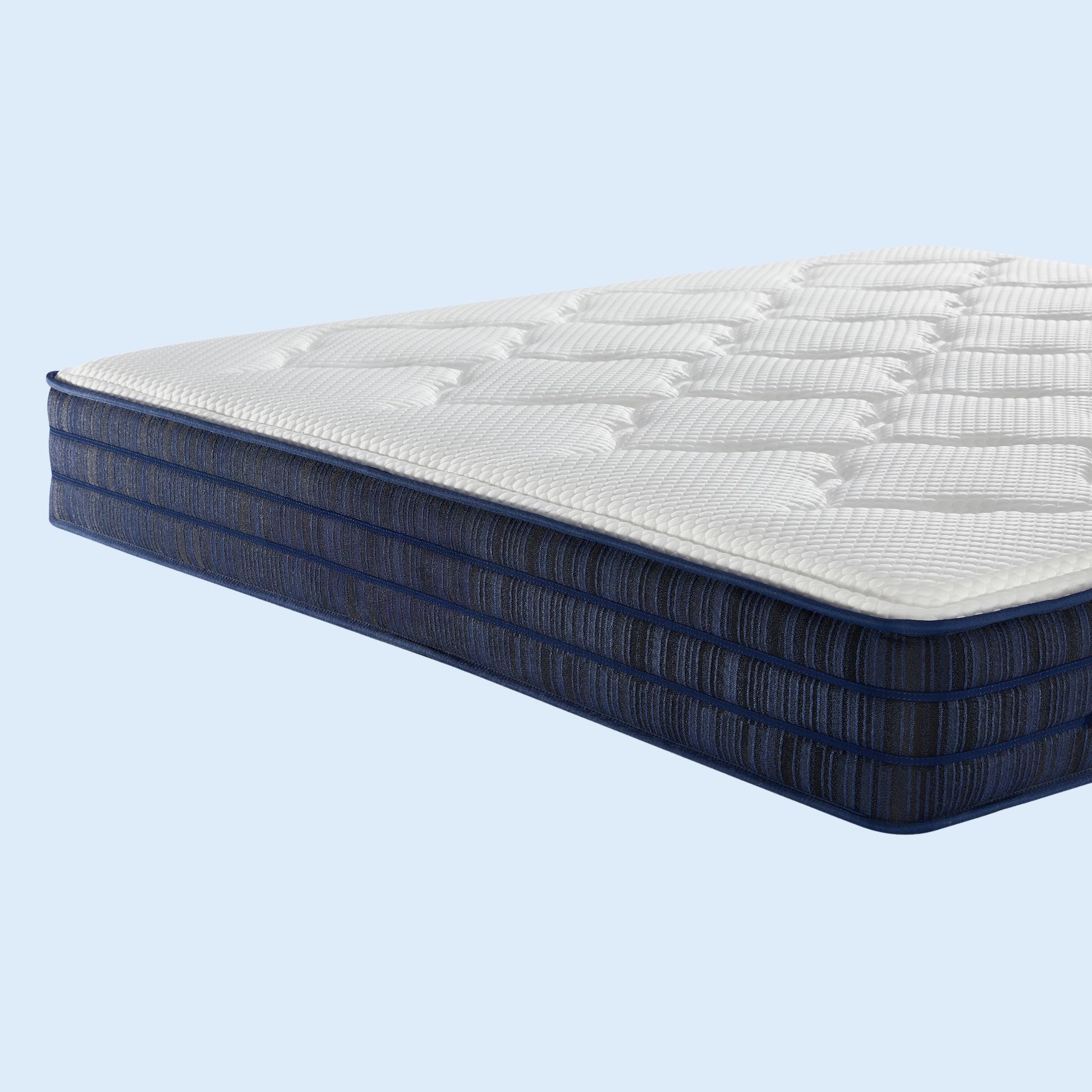 Mattress with blue exterior and white interior on a light blue background