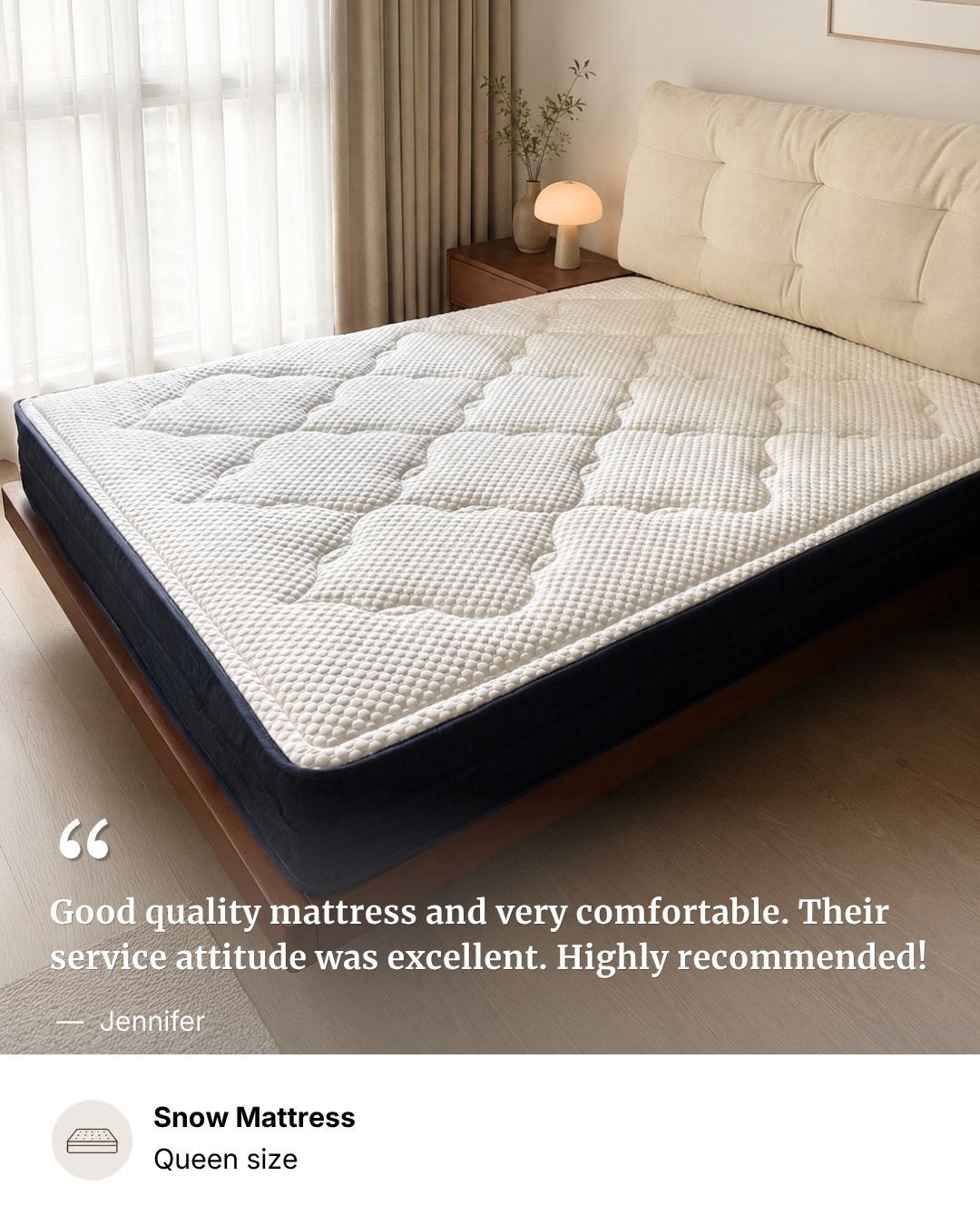 A quilted white mattress with a dark navy side panel shown on a bed in a softly lit bedroom. The image includes a customer review quote and text identifying the product as Snow Mattress, Queen size.