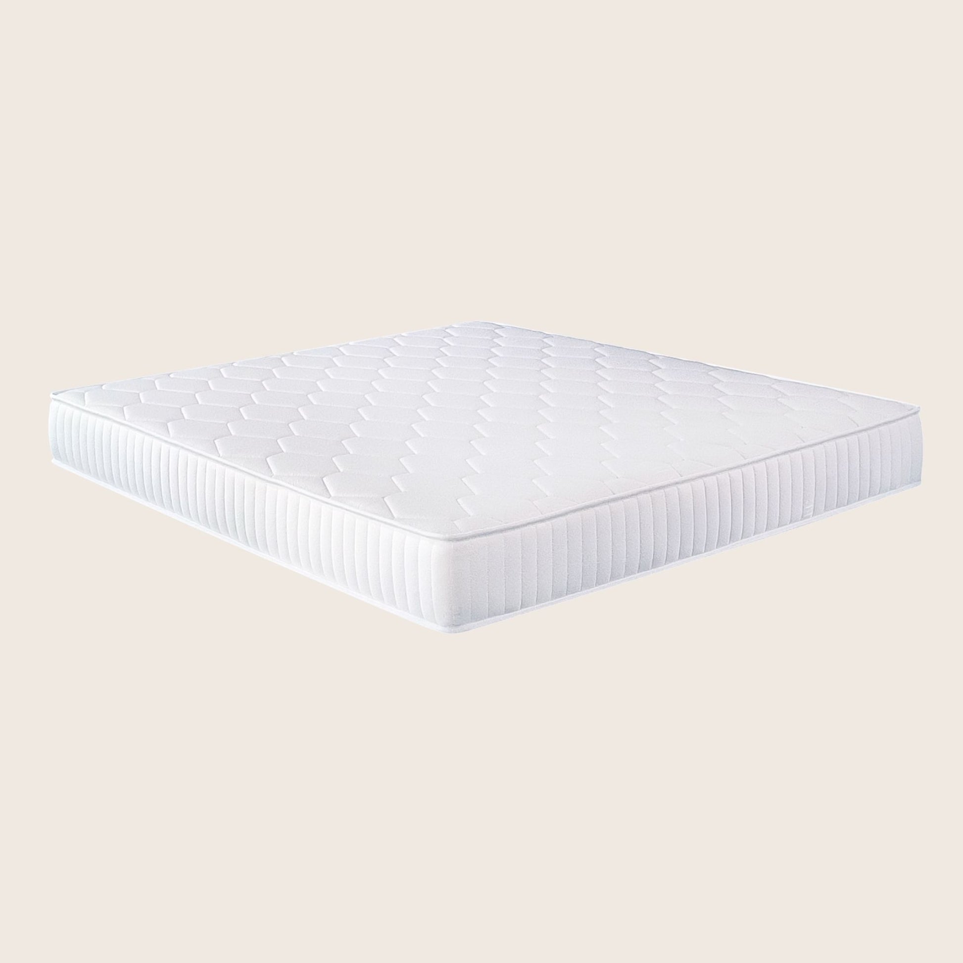 White mattress on a beige background