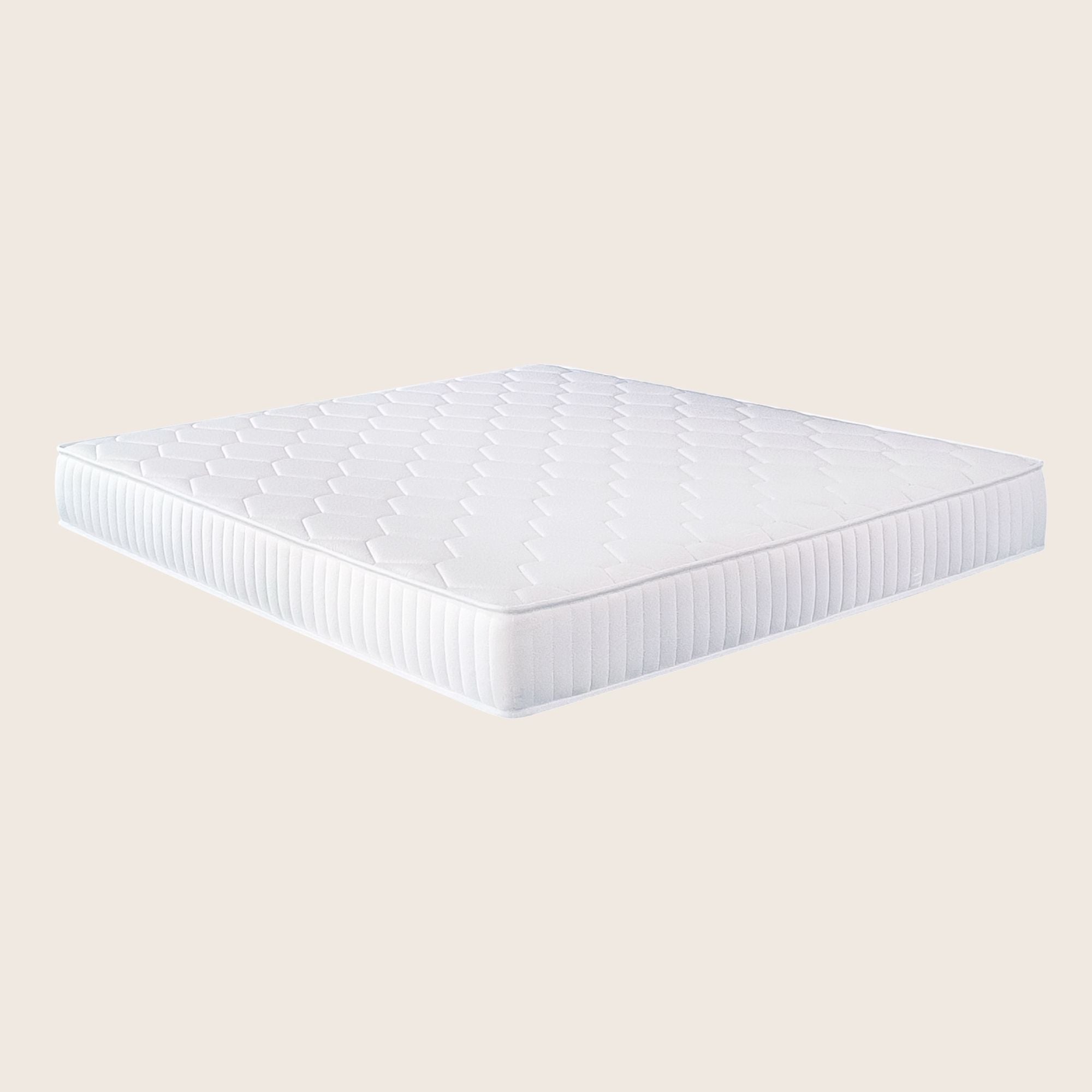 White mattress on a beige background
