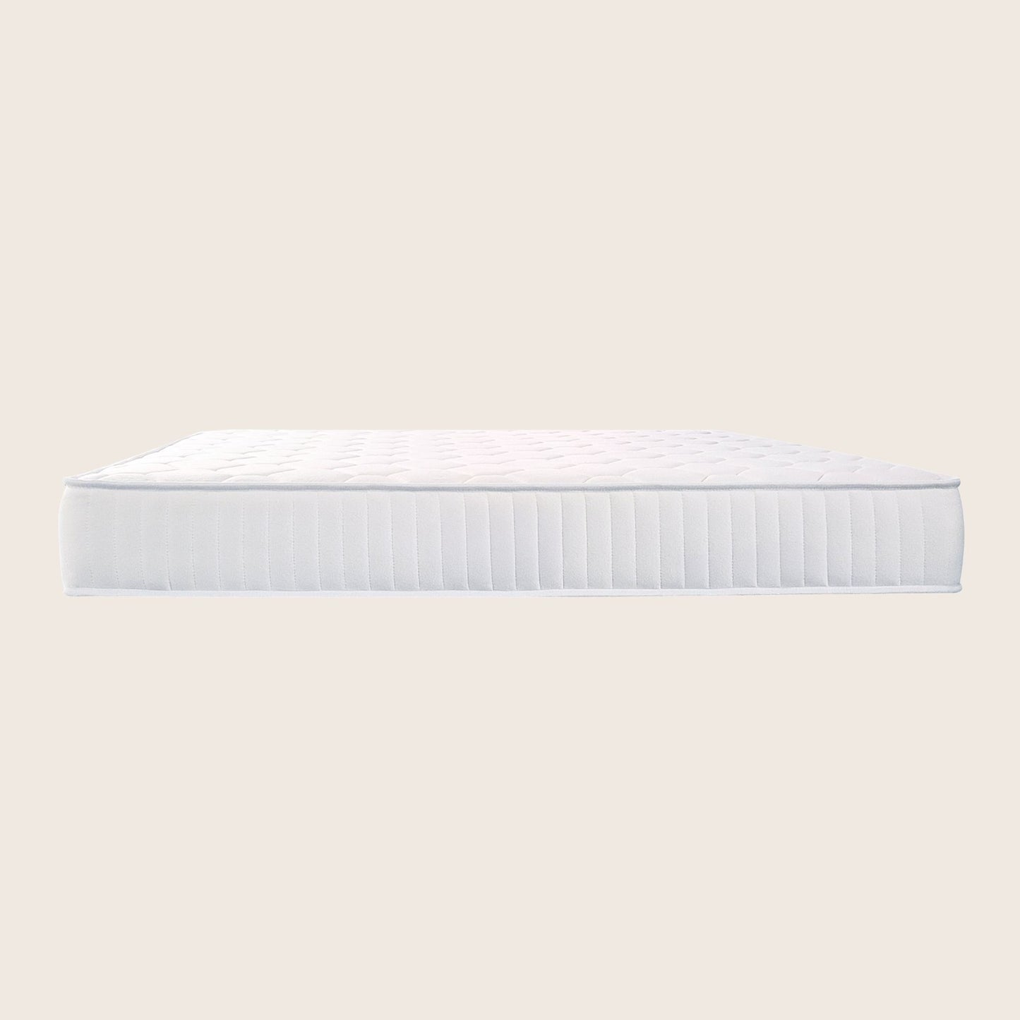 White mattress on a light beige background