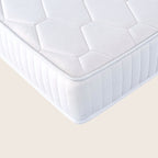White quilted mattress on a beige background