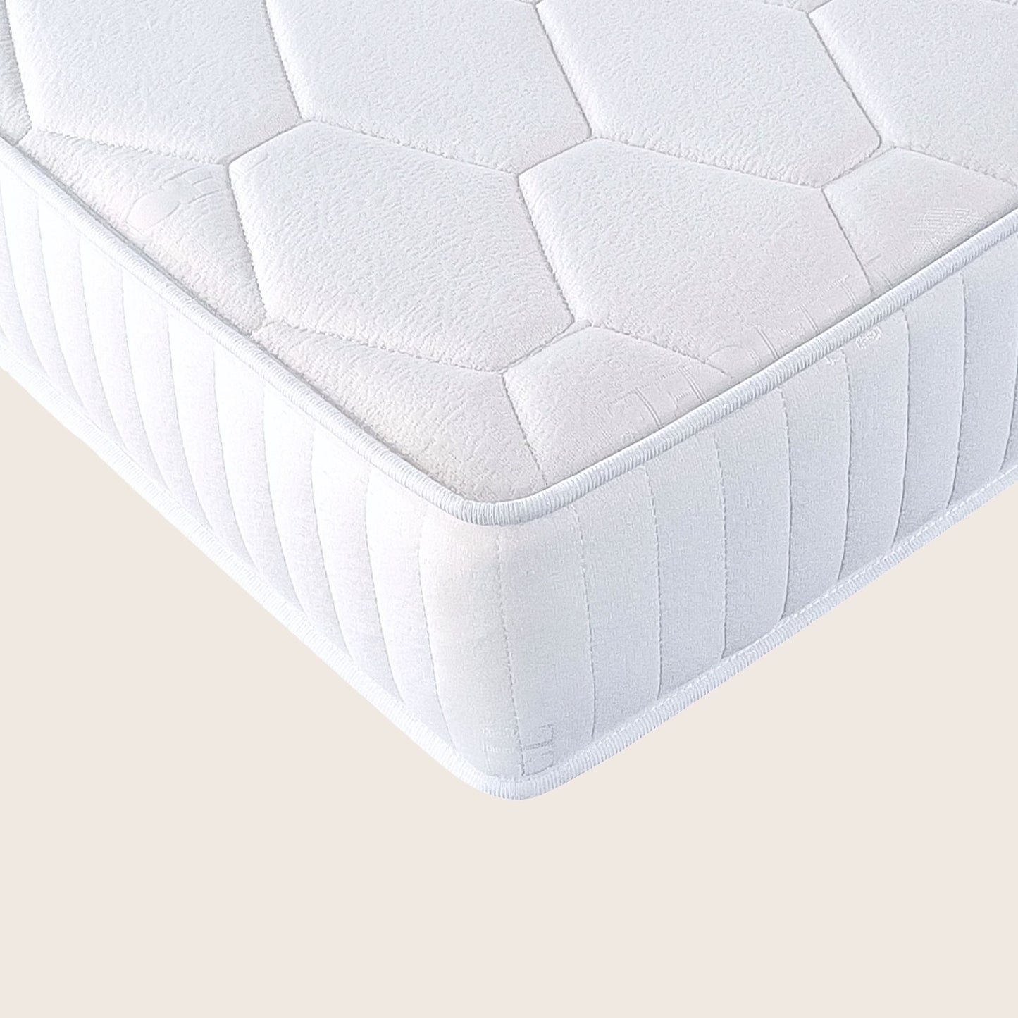 White quilted mattress on a beige background
