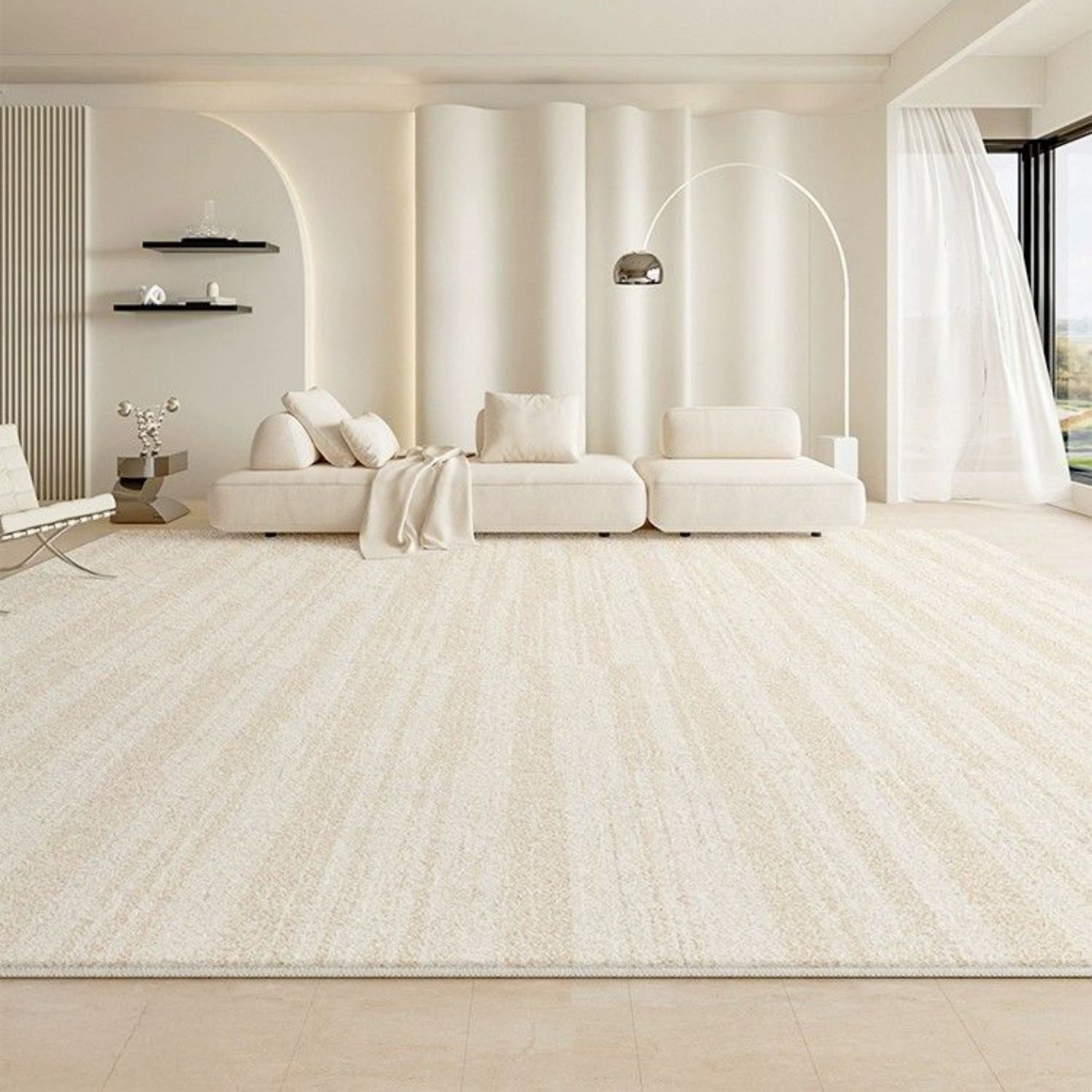 Modern living room with white furniture and a large window