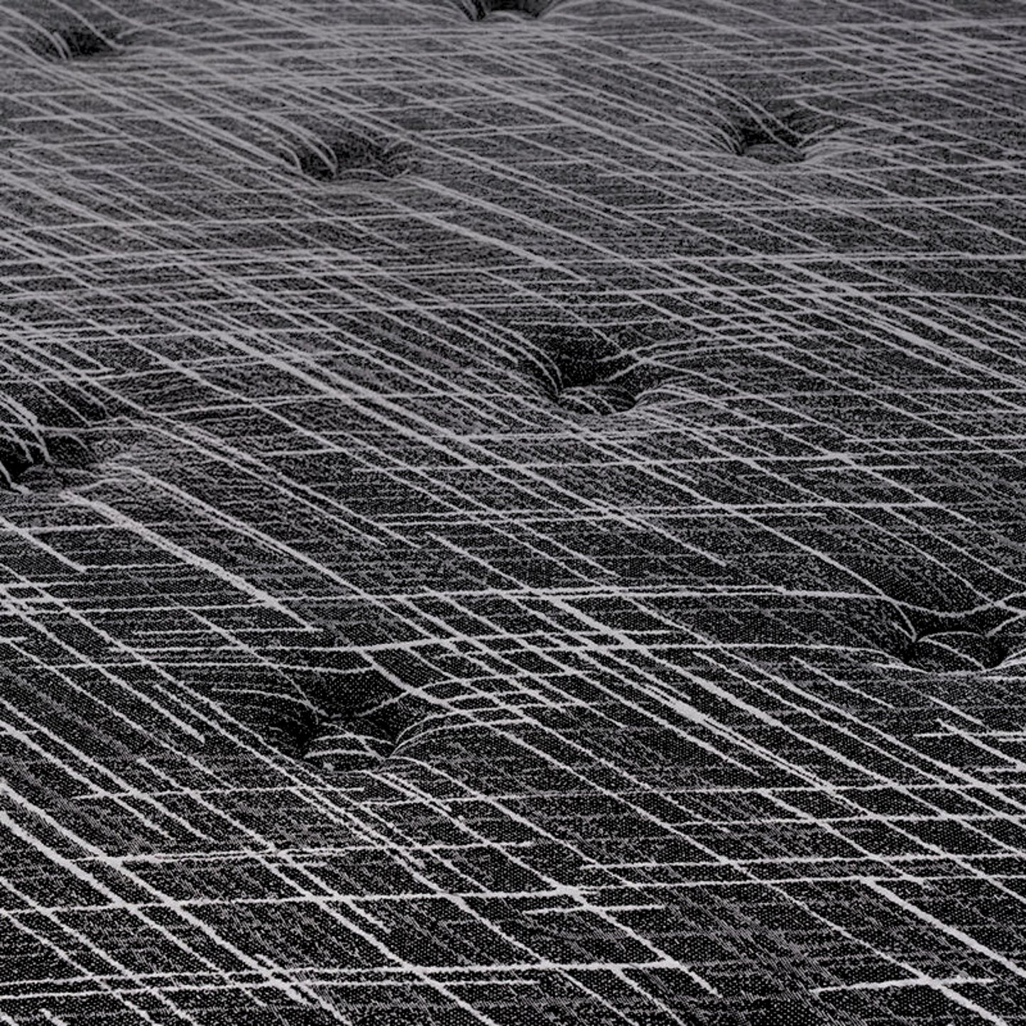 Close-up of a textured black and white patterned surface for mattress
