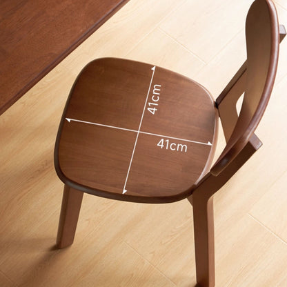 Wooden chair seat with measurements on a light wood floor