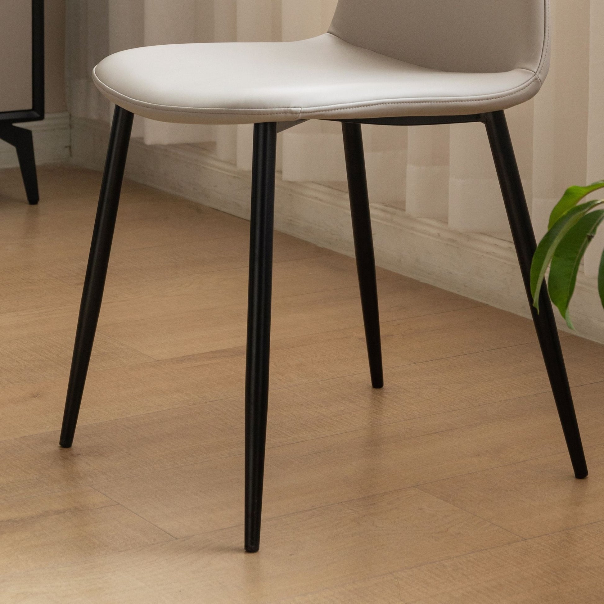 Chair with black legs on a wooden floor