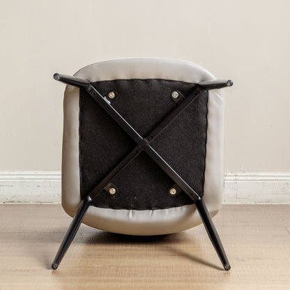 Chair with black metal frame and cushioned seat on a wooden floor.