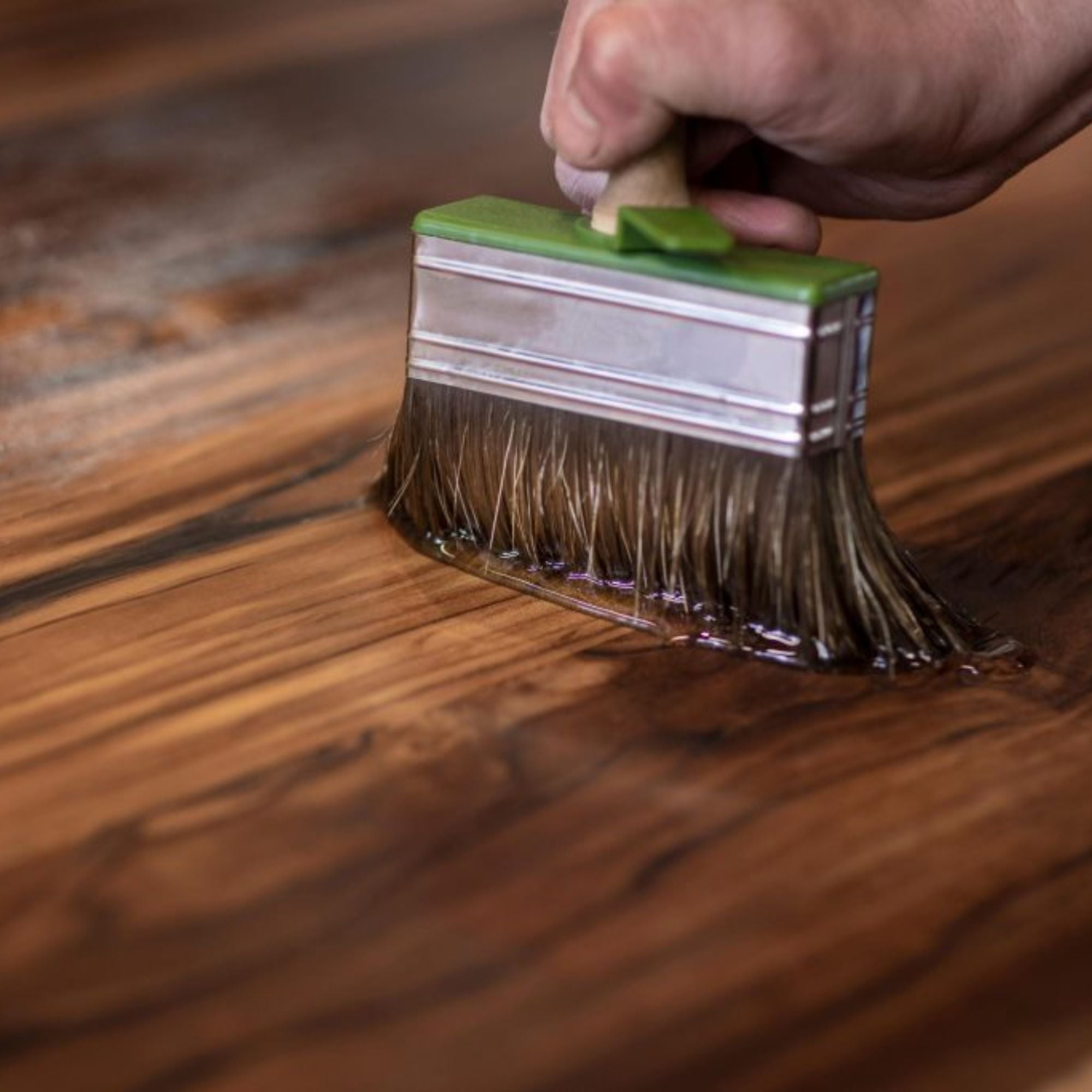 Applying wood finish with brush